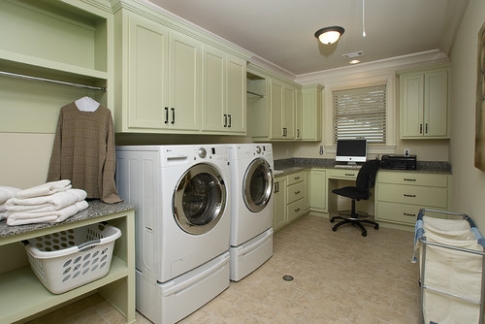 Laundry room with cabinets painted colour trend Guilford Green